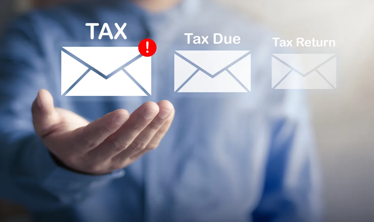 CRA audit letter and tax documents on a desk